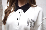 Felpa polo con strass blu o panna